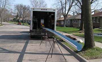 A truck with gutter equipment.